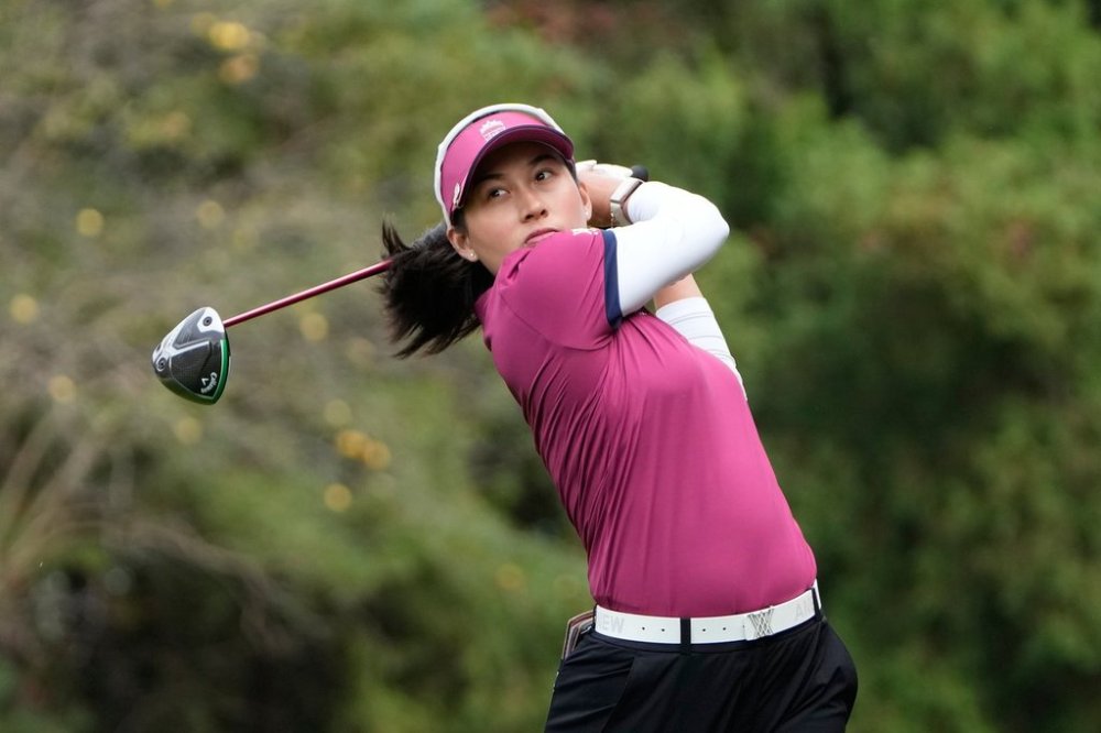 Jeeno Thitikul of Thailand watches her shot on the third hole during the pool A match against the United States for day two of the LPGA International Crown golf tournament at the New Korea Country Club in Goyang, South Korea, Friday, Oct. 24, 2025. (AP Photo/Ahn Young-joon)