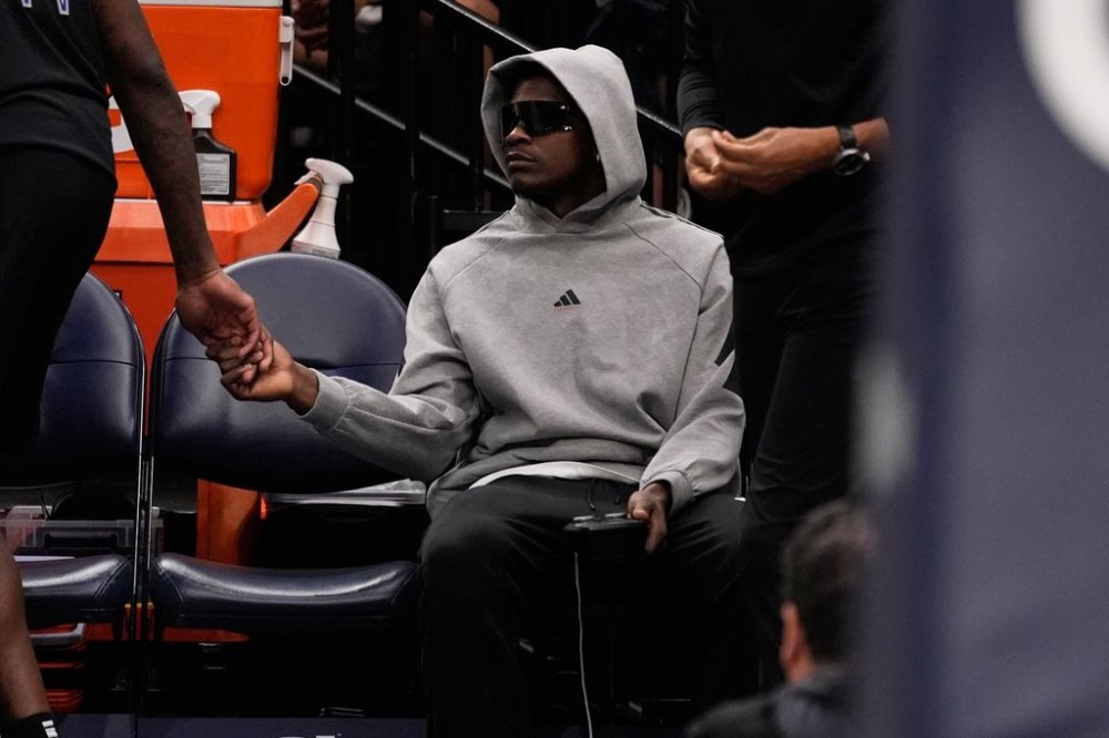 Minnesota Timberwolves guard Anthony Edwards sits on the bench during the first half of an NBA basketball game against the Indiana Pacers, Sunday, Oct. 26, 2025, in Minneapolis. (AP Photo/Abbie Parr)