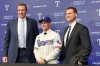 Texas Rangers new manager Skip Schumaker, center, poses with Chris Young, the Rangers president of baseball operations, and general manager Ross Fenstermaker during a baseball news conference, Friday, Oct. 10, 2025, in Arlington, Texas. (AP Photo/Stephen Hawkins)