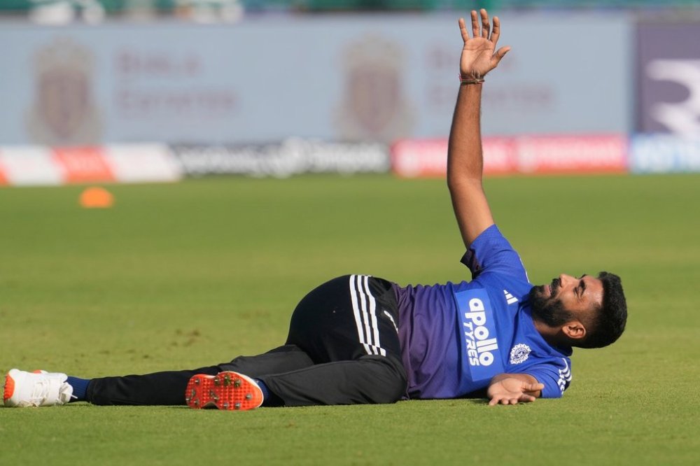 India's Jasprit Bumrah warms up before the start of the first day of the second cricket test match between India and West Indies at the Arun Jaitley Stadium in New Delhi, India, Friday, Oct.10, 2025. (AP Photo/Manish Swarup)