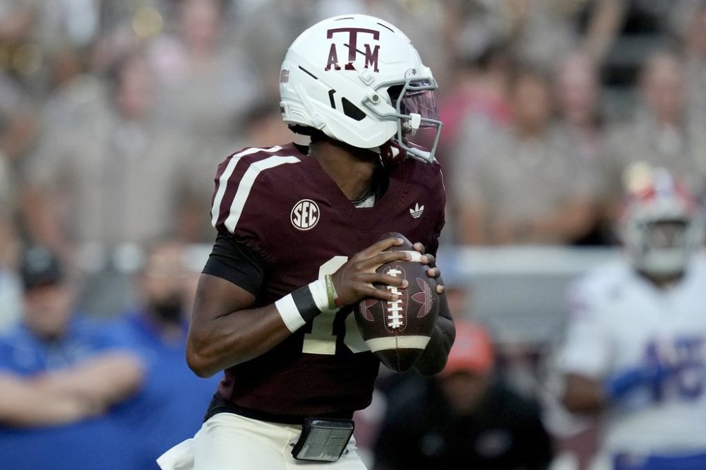 Texas A&M quarterback Marcel Reed (10) looks to pass downfield against Florida during the first quarter of an NCAA college football game Saturday, Oct. 11, 2025, in College Station, Texas. (AP Photo/Sam Craft)
