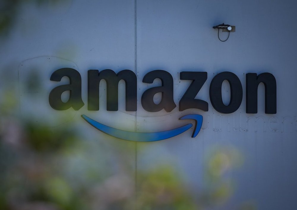 The Amazon logo is seen on the outside of the company's YVR2 fulfilment centre, in Delta, B.C., on Friday, July 11, 2025. Unifor says the B.C. Labour Relations Board has awarded union certification to workers at the facility and that they will now begin the process of negotiating a first contract. THE CANADIAN PRESS/Darryl Dyck