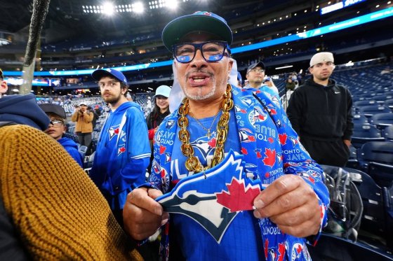 A Toronto Blue Jays fan cheers ahead of Game 2 of the World Series playoff against the Los Angeles Dodgers in Toronto on Saturday. (Frank Gunn / The Canadian Press files)