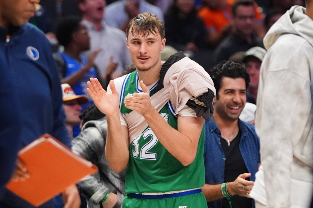 Dallas Mavericks forward Cooper Flagg looks on from the sidelines during the second half of an NBA basketball game against the Oklahoma City Thunder in Dallas, Monday, Oct. 27, 2025. (AP Photo/LM Otero)