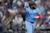 Toronto Blue Jays' Vladimir Guerrero Jr. flips his bat after hitting a two run against the Los Angeles Dodgers during the third inning in Game 4 of baseball's World Series, Tuesday, Oct. 28, 2025, in Los Angeles. (AP Photo/Ashley Landis)