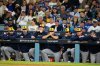 Members of the Milwaukee Brewers watch during the eighth inning in Game 4 of baseball's National League Championship Series against the Los Angeles Dodgers, Friday, Oct. 17, 2025, in Los Angeles. (AP Photo/Ashley Landis)