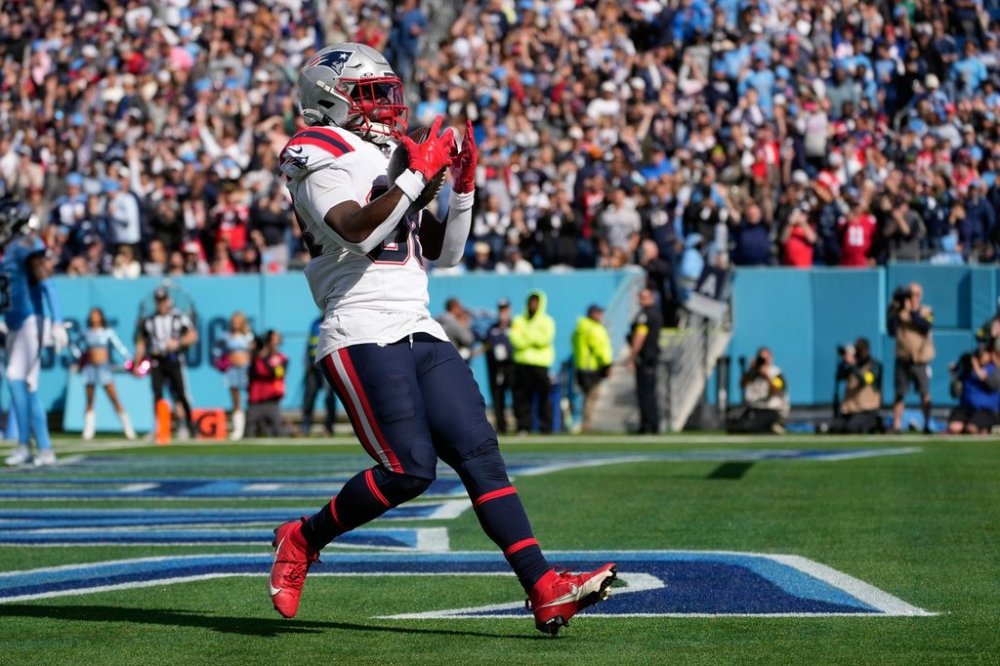 New England Patriots running back Rhamondre Stevenson (38) celebrates a touchdown during the second half of an NFL football game against the Tennessee Titans, Sunday, Oct. 19, 2025, in Nashville, Tenn. (AP Photo/George Walker IV)