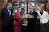 Jesus Maria Tarriba, left, and Diana Fox Carney, right, look on as Mexican President Claudia Sheinbaum presents a gift to Prime Minister Mark Carney at the National Palace in Mexico City on Thursday, Sept. 18, 2025. THE CANADIAN PRESS/Adrian Wyld