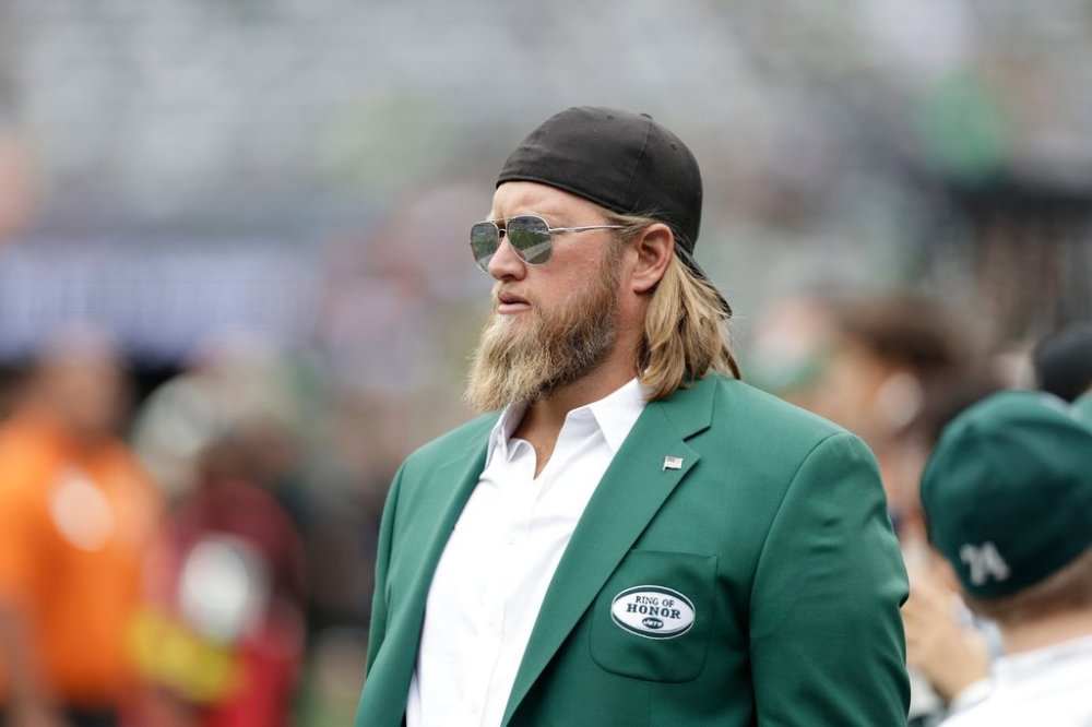 FILE - Former New York Jets player Nick Mangold walks the field before an NFL football game against the Cincinnati Bengals, Sept. 25, 2022, in East Rutherford, N.J. (AP Photo/Adam Hunger, File)