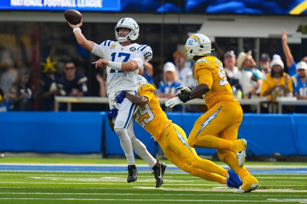 Indianapolis Colts quarterback Daniel Jones (17) throws under pressure from Los Angeles Chargers cornerback Tarheeb Still (29) during the first half of an NFL football game Sunday, Oct. 19, 2025, in Inglewood, Calif. (AP Photo/Gregory Bull)