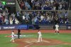 Blue Jays first baseman Vladimir Guerrero Jr. (27) reacts after scoring on a wild throw by Seattle Mariners catcher Cal Raleigh (29) during the seventh inning of Game 6 of baseball's American League Championship Series in Toronto on Oct. 19, 2025. THE CANADIAN PRESS/Chris Young