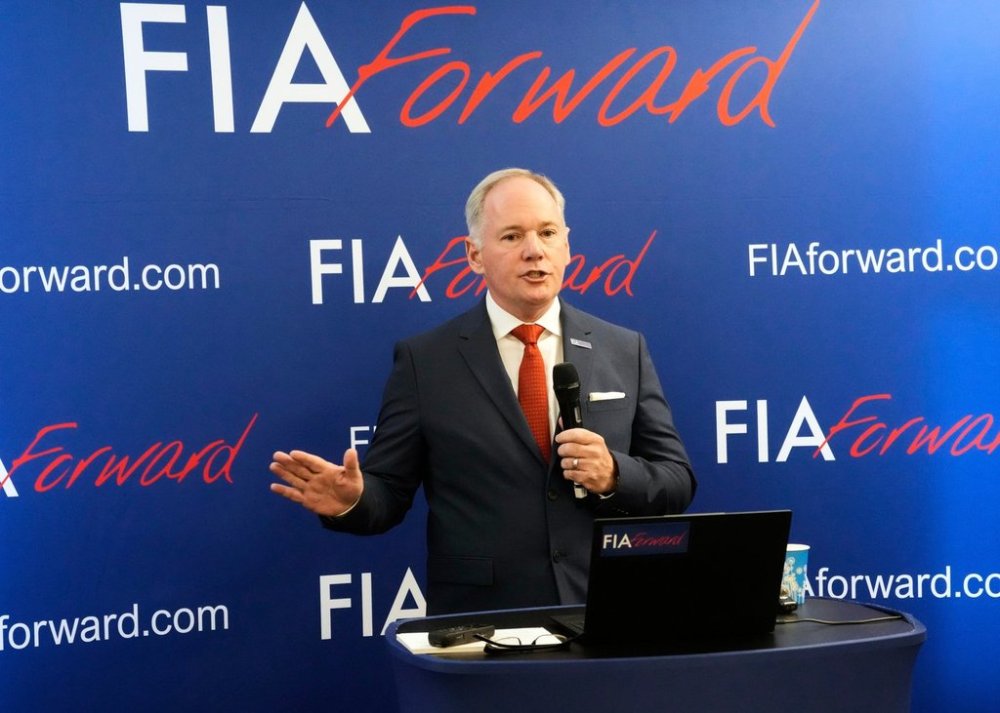 FILE - Tim Mayer, the son of former McLaren team principal Teddy Mayer addresses the media after announcing that he is running for the presidency of motorsport's governing body the FIA in December's election, in Whittlebury Park, England, Friday, July 4, 2025. (AP Photo/Darko Bandic, file )