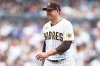 FILE - San Diego Padres' Craig Stammen smiles as he walks towards his dugout during a baseball game against the San Francisco Giants, Oct. 5, 2022, in San Diego. (AP Photo/Derrick Tuskan)