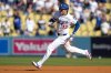 Los Angeles Dodgers' Shohei Ohtani rounds the bases after a triple against the Milwaukee Brewers during the first inning in Game 3 of baseball's National League Championship Series, Thursday, Oct. 16, 2025, in Los Angeles. (AP Photo/Ashley Landis)