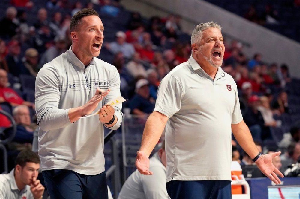 FILE - Auburn head coach Bruce Pearl, right, and his son, assistant coach Steven Pearl, call out to their players during the second half of an NCAA college basketball game against Mississippi in Oxford, Miss., Tuesday, Jan. 10, 2023. (AP Photo/Rogelio V. Solis, File)