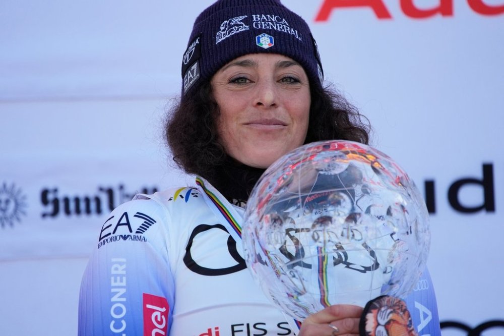 FILE - Italy's Federica Brignone reacts on the podium after winning the women's World Cup overall at the World Cup Finals, Thursday, March 27, 2025, in Sun Valley, Idaho. (AP Photo/John Locher, File)