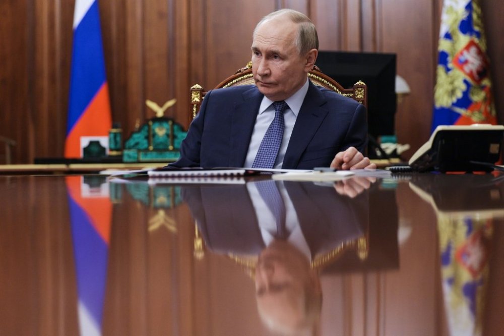 Russian President Vladimir Putin listens to the head of the Federal Service for Supervision of Natural Resources (Rosprirodnadzor) Svetlana Radionova during their meeting at the Kremlin in Moscow, Russia, on Tuesday, Oct. 21, 2025. (Alexander Kazakov, Sputnik, Kremlin Pool Photo via AP)
