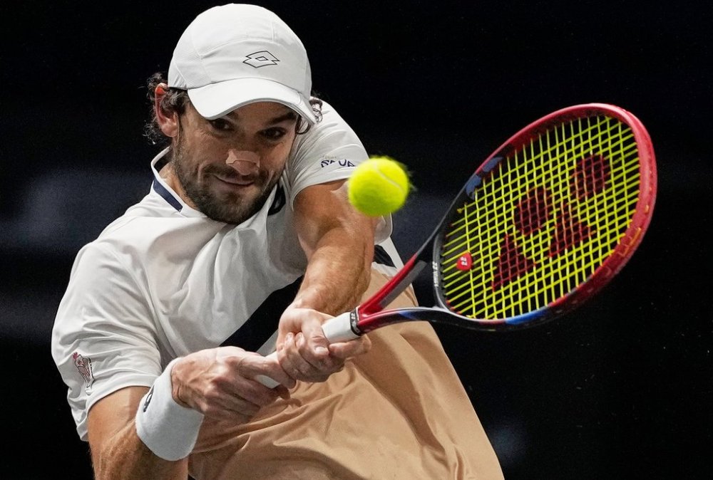 Vacherot of Monaco serves the ball to Cameron Norrie of Great Britain during their third round men's singles match at the Paris Masters tennis tournament at the Paris La Defense Arena, Thursday, Oct. 30, 2025, in Paris. (AP Photo/Michel Euler)