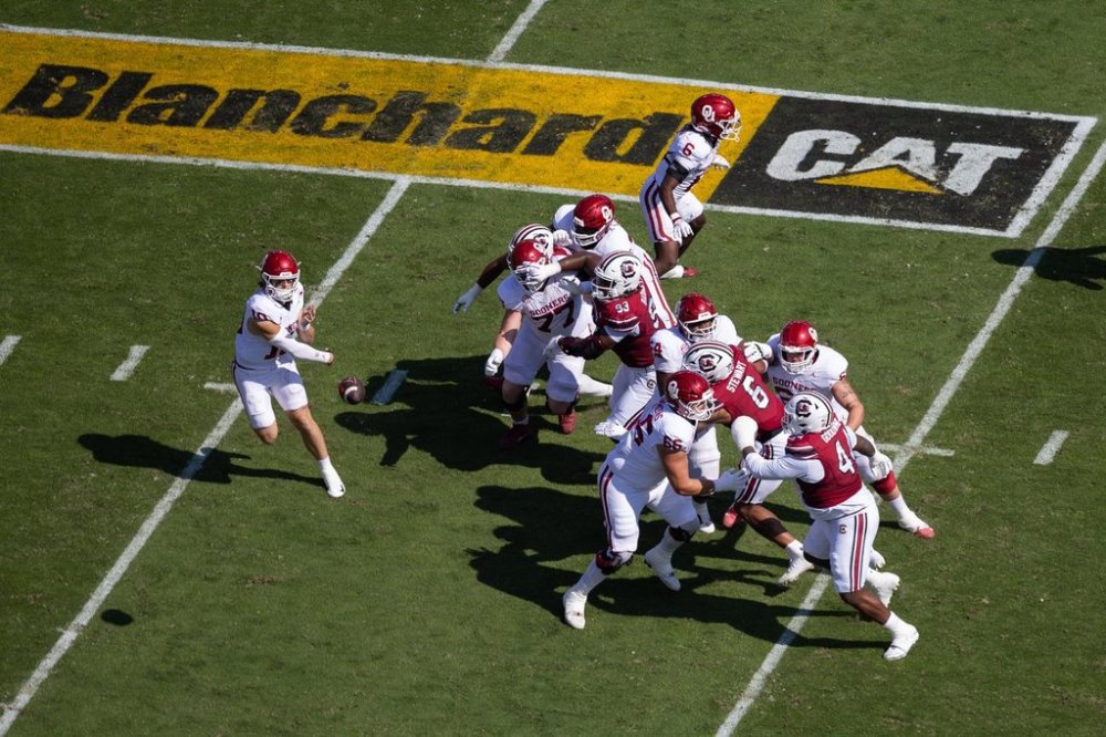 A Blanchard Cat logo is displayed on the field as Oklahoma quarterback John Mateer (10) throws against South Carolina during an NCAA college football game, Saturday, Oct. 18, 2025, in Columbia, S.C. (AP Photo/Scott Kinser)