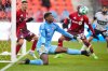 Toronto FC goalkeeper Sean Johnson (1) moves to block a shot during second half MLS soccer action against the Vancouver Whitecaps, in Toronto on Saturday, March 29, 2025. THE CANADIAN PRESS/Arlyn McAdorey
