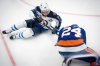 Winnipeg Jets center Jonathan Toews (19) collides with New York Islanders defenseman Scott Mayfield (24) during the first period of an NHL hockey game, Monday, Oct. 13, 2025, in Elmont, N.Y. (AP Photo/Angelina Katsanis)