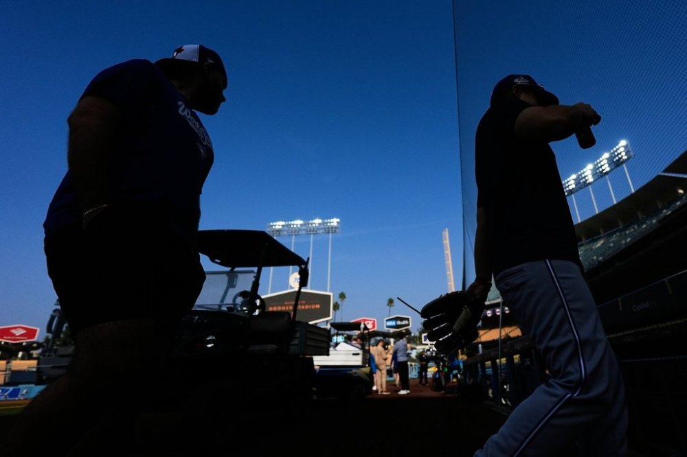 Toronto Blue Jays players work out ahead of Game 3 of the 2025 World Series against the Los Angeles Dodgers in Los Angeles, Sunday, Oct. 26, 2025. (AP Photo/Ashley Landis)