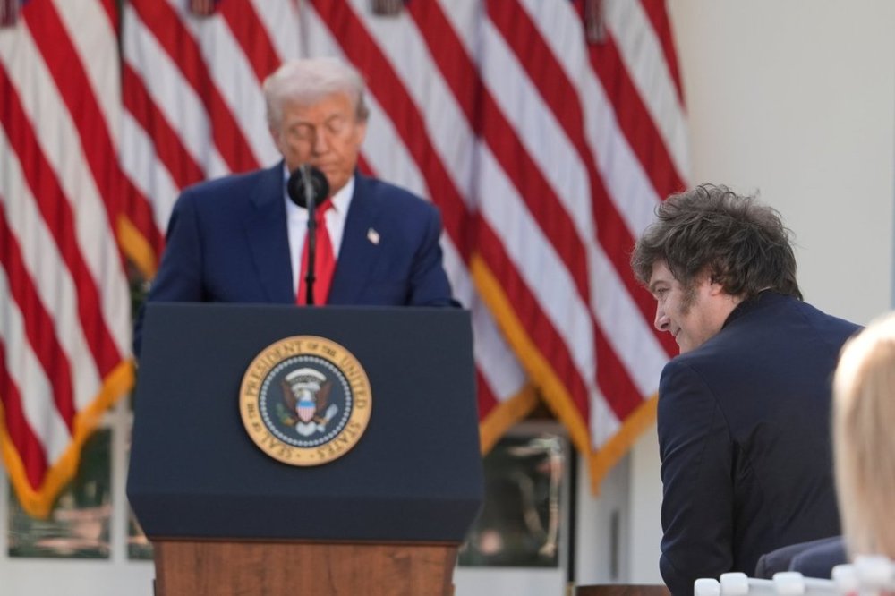 Argentina's President Javier Milei stands as President Donald Trump recognizes him as he speaks before posthumously awarding the Presidential Medal of Freedom to Charlie Kirk in the Rose Garden of the White House, Tuesday, Oct. 14, 2025, in Washington. (AP Photo/Alex Brandon)