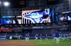 Members of the Los Angeles Dodgers warn up during a World Series baseball media day, Thursday, Oct. 23, 2025, in Toronto. The Toronto Blue Jays face the Los Angeles Dodgers in Game 1 on Friday. (AP Photo/Brynn Anderson)