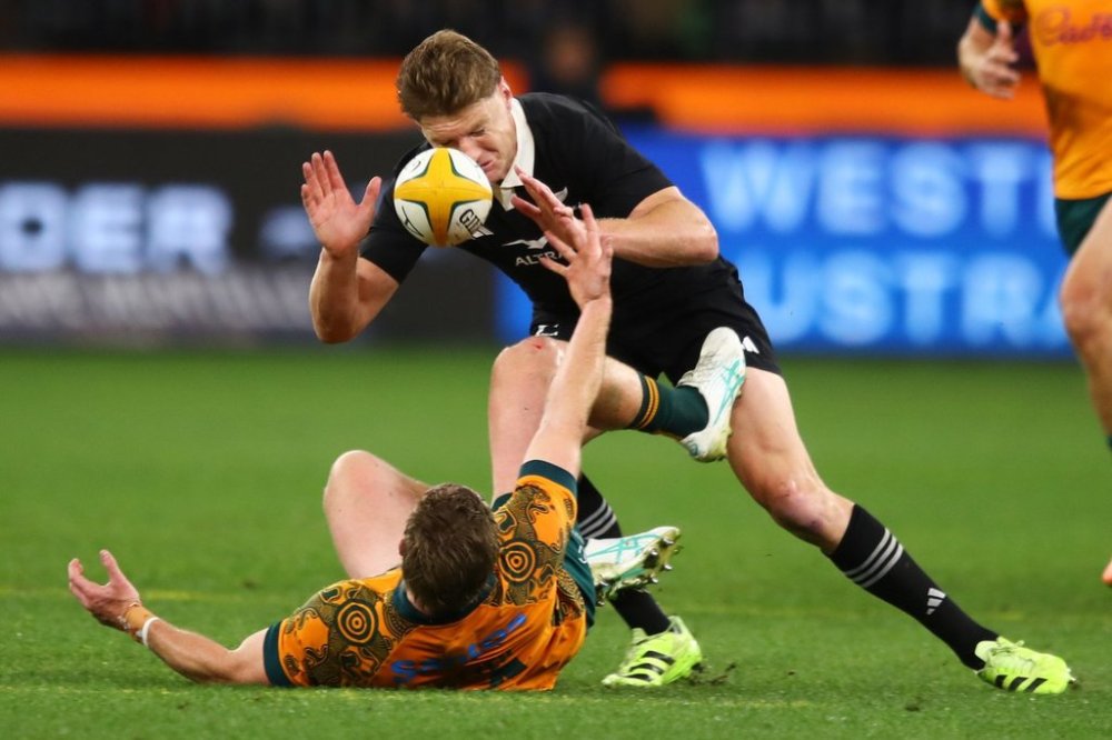 New Zealand's Jordie Barrett reacts as he competes for the ball with Australia's Harry Potter during the Bledisloe Cup rugby test between the All Blacks and the Wallabies in Perth, Australia, Saturday, Oct 4, 2025. (AP Photo/Gary Day)