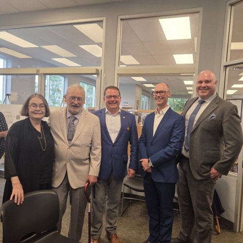 From left to right: Ann Munsch, author Robert Munsch, Guelph MPP Mike Schreiner, Guelph Public Library CEO Dan Atkins and GPL Chairperson Danny Williamson pose for a photo in Guelph, Ont., in a 2025 handout photo. Munsch is donating his stash of story drafts, publisher notes and fan letters to the Guelph Public Library. THE CANADIAN PRESS/Handout - Guelph Public Library, Kirsten Bester (Mandatory Credit)