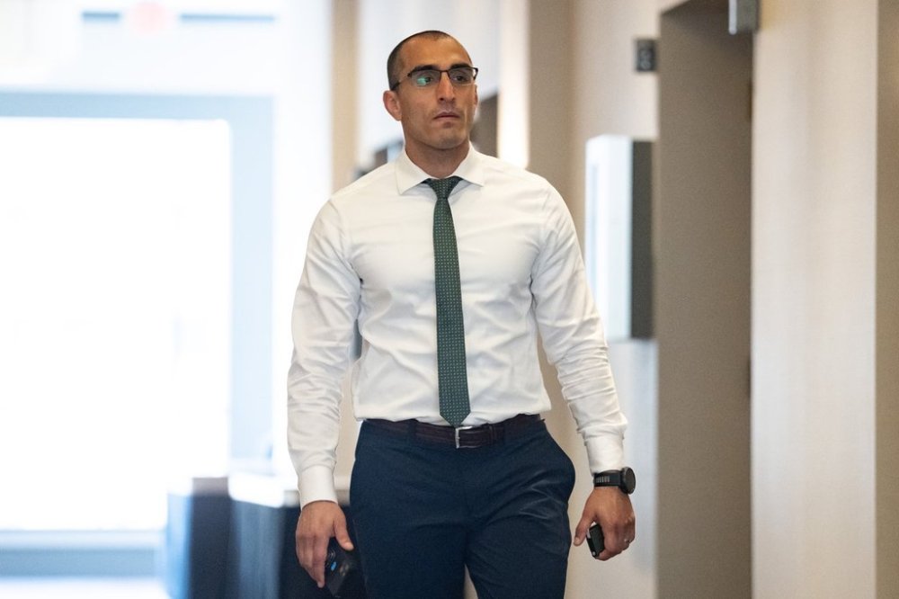 Coquitlam RCMP constable Mersad Mesbah returns to an RCMP code of conduct hearing on Wednesday, Sept. 17, 2025. THE CANADIAN PRESS/Ethan Cairns