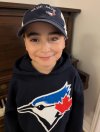 Eight-year-old Logan Dorna shows off his custom-made Blue Jays prosthetic eye in this undated handout as he celebrates the team's playoff run. THE CANADIAN PRESS/Handout - The Dorna Family (Mandatory Credit)