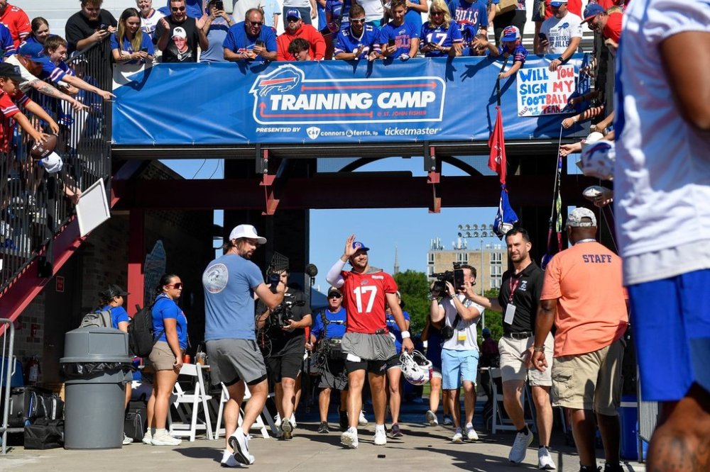 FILE - Buffalo Bills quarterback Josh Allen (17) walks to the field before practice at the team's NFL football training camp, Wednesday, July 23, 2025, in Pittsford, N.Y. (AP Photo/Adrian Kraus, File)