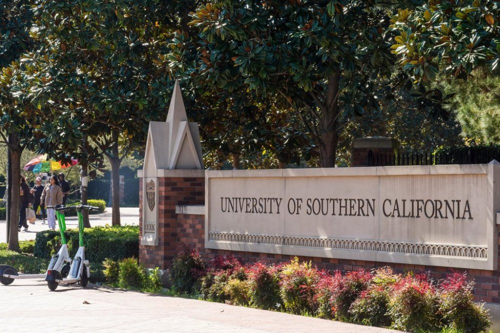 FILE - A sign for the University of Southern California is displayed at a campus entrance in Los Angeles, April 16, 2024. (AP Photo/Damian Dovarganes, File)