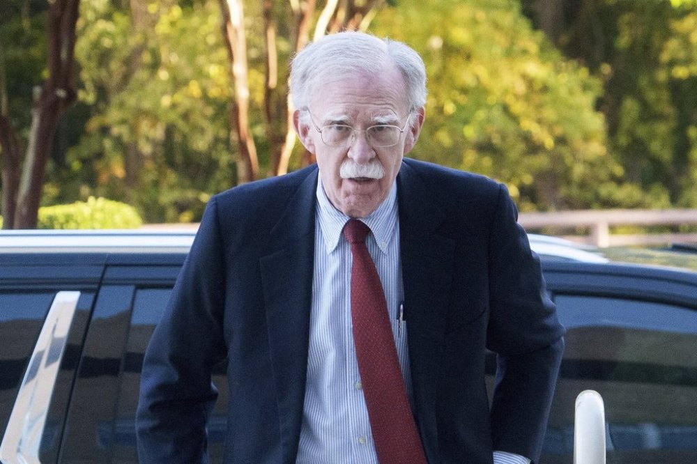 Former Trump administration national security adviser John Bolton, left, arrives for his arraignment at the Greenbelt Federal Courthouse in Greenbelt, Md., Friday, Oct. 17, 2025. (AP Photo/Rod Lamkey, Jr.)