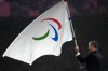 FILE - President of the International Paralympic Committee Andrew Parsons passes the Paralympic flag to Mayor of Los Angeles Karen Bass, not in photo, after receiving it from Mayor of Paris Anne Hidalgo, not in photo, during the closing ceremony of the 2024 Paralympics, Sunday, Sept. 8, 2024, in Paris, France. (AP Photo/Michel Euler, File)
