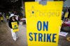 A member of the British Columbia General Employees' Union pickets outside an ICBC driver licensing office, in Surrey, B.C., Monday, Sept. 8, 2025. THE CANADIAN PRESS