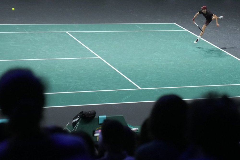 Jannik Sinner of Italy serves to Zizou Bergs of Belgium during their second round match of the Paris Masters tennis tournament at the Paris La Defense Arena, Wednesday, Oct. 29, 2025, in Paris. (AP Photo/Christophe Ena)