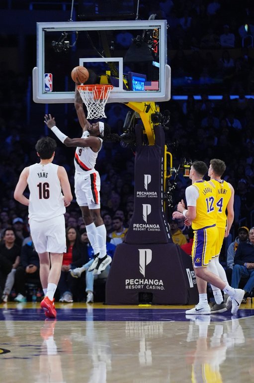 Portland Trail Blazers forward Jerami Grant (9) lays up during the first half of an NBA basketball game, Monday, Oct. 27, 2025, in Los Angeles. (AP Photo/Ethan Swope)