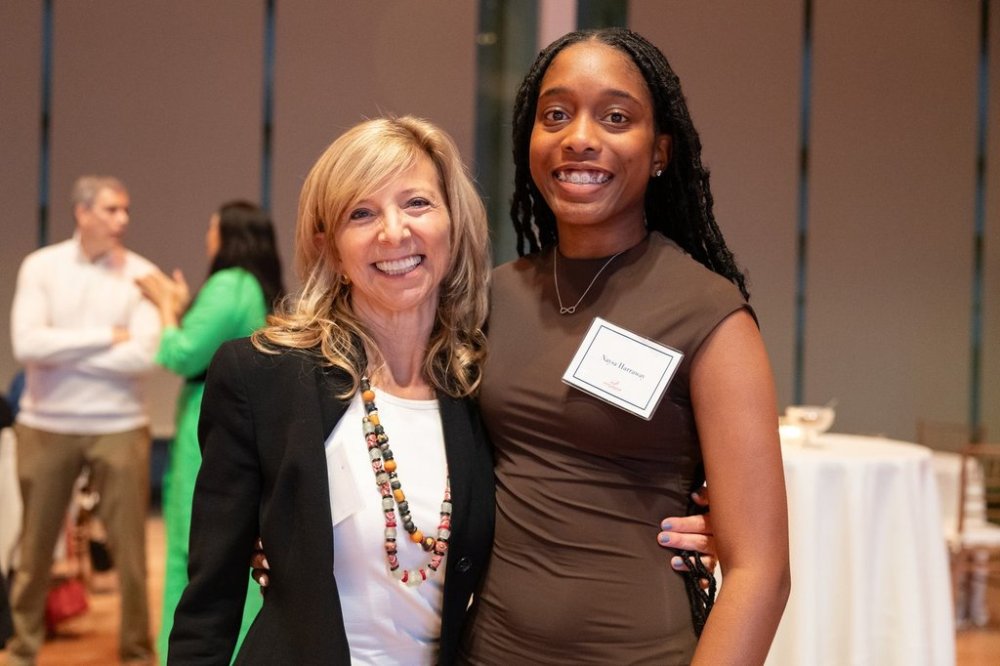 In this photo provided by National Education Equity Lab, Leslie Cornfeld, left, founder of the National Education Equity Lab, stands with Howard University alum Naysa Harraway at an Equity Lab event in New York, 2023. (National Education Equity Lab)