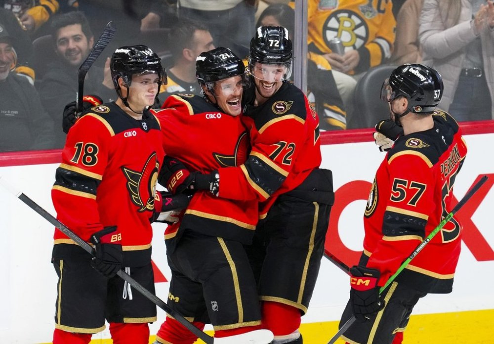 Ottawa Senators Nick Cousins (21) celebrates his third period goal with teammates Tim Stützle (18), Thomas Chabot (72) and David Perron (57) against the Boston Bruins in NHL hockey action in Ottawa on Monday, Oct. 27, 2025. THE CANADIAN PRESS/Sean Kilpatrick