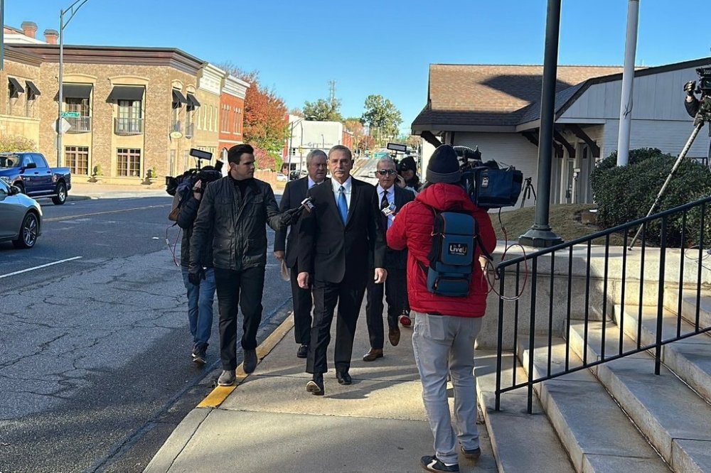 Former Spartanburg County Sheriff Chuck Wright is asked a question as he walks into a federal courthouse to plead guilty in Anderson, S.C., Thursday, Oct. 30, 2025. (AP Photo/Jeffrey Collins)