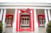 FILE - A large ribbon is displayed outside the East Wing of the White House during a preview of the 2016 holiday decor, Nov. 29, 2016, in Washington. (AP Photo/Andrew Harnik, File)