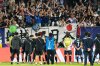 Japan players stand in front of their fans after losing a FIFA U-20 World Cup round of sixteen soccer match against France at National Stadium in Santiago, Chile, Wednesday, Oct. 8, 2025. (AP Photo/Matias Delacroix)