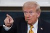 President Donald Trump points to a reporter during a roundtable in the State Dining Room of the White House on Thursday, Oct. 23, 2025, in Washington. (AP Photo/Evan Vucci)