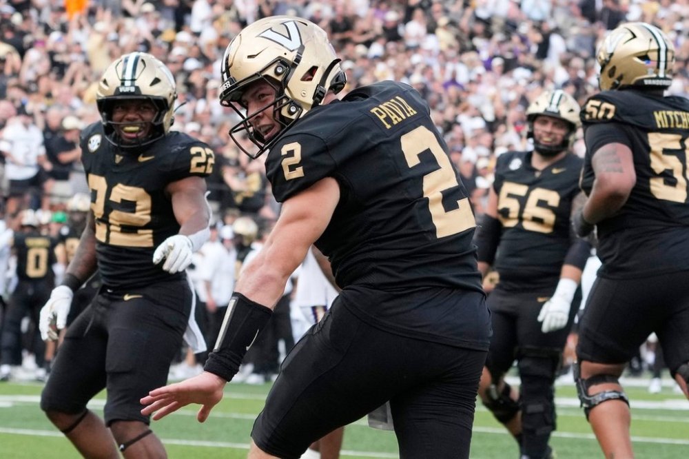 Vanderbilt quarterback Diego Pavia (2) celebrates his touchdown during the second half of an NCAA college football game against LSU, Saturday, Oct. 18, 2025, in Nashville, Tenn. (AP Photo/George Walker IV)