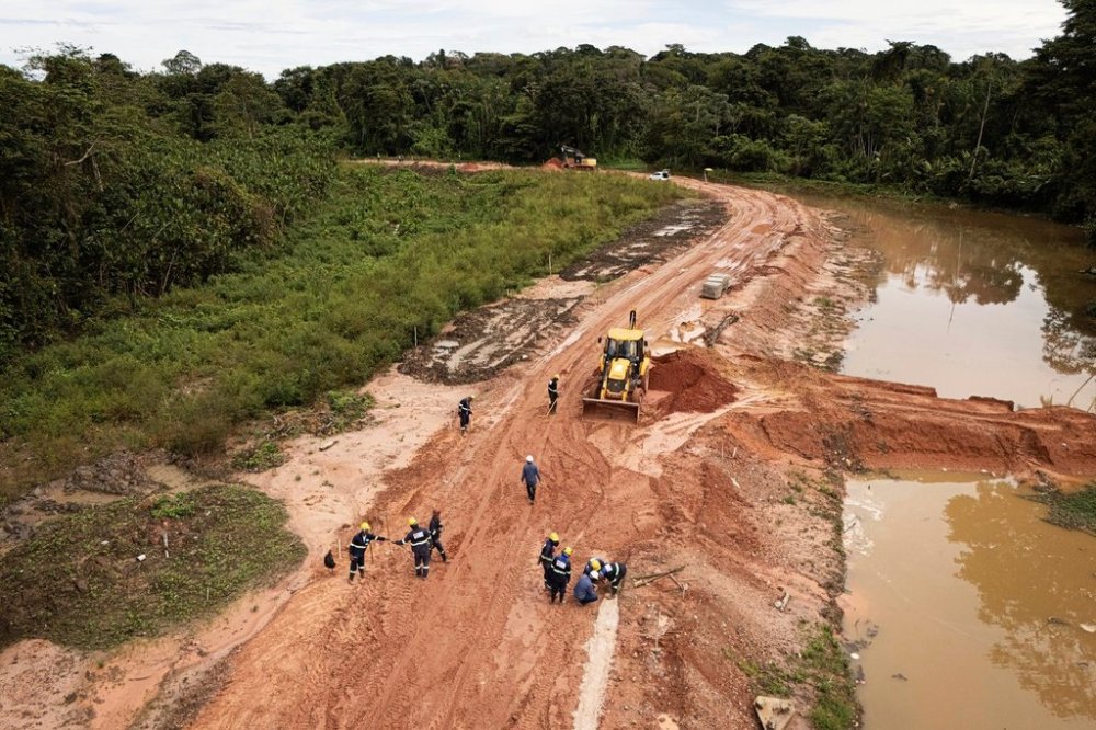 FILE - Workers construct an avenue, named Liberdade, or Freedom, ahead of the COP30 U.N. Climate Summit in Belem, Brazil, March 18, 2025. (AP Photo/Jorge Saenz, File)