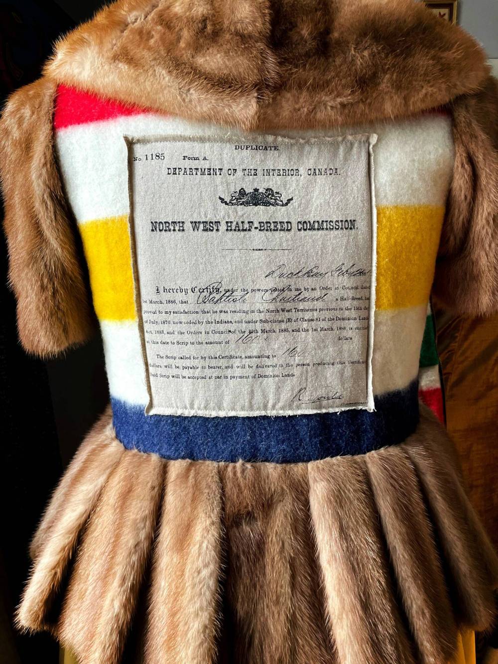 RUTH BONNEVILLE / FREE PRESS
Amy McPherson’s mink fur coat with partial remnant of a Hudson’s Bay Blanket land script from her genealogy which she created at the Banff Centre .