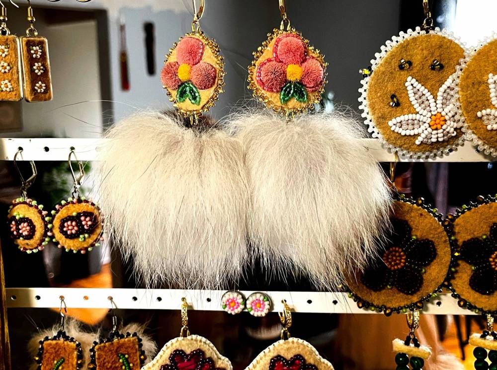 RUTH BONNEVILLE / FREE PRESS
Amy McPherson's caribou tufted fur and fox pom pom earrings.