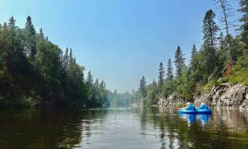 Dorothy Mackintosh photo
                                Gord and Margie Mackintosh float down the Pinawa Channel.